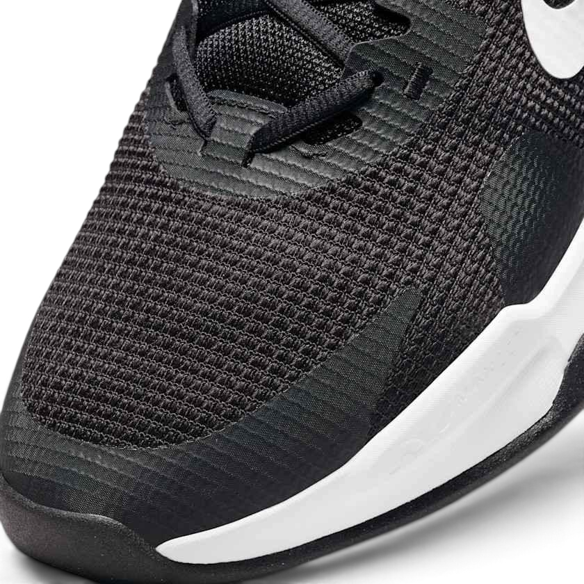 Close-up zoom on the front of the Nike Air Max Alpha Trainer 5 Men's black, showing the mesh upper texture, durable toe cap, and lacing system.