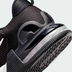 Detailed zoom on the outsole and midsole of the Nike Air Max Alpha Trainer 5 Men's black, highlighting the cushioned foam, visible Max Air, and sturdy rubber.