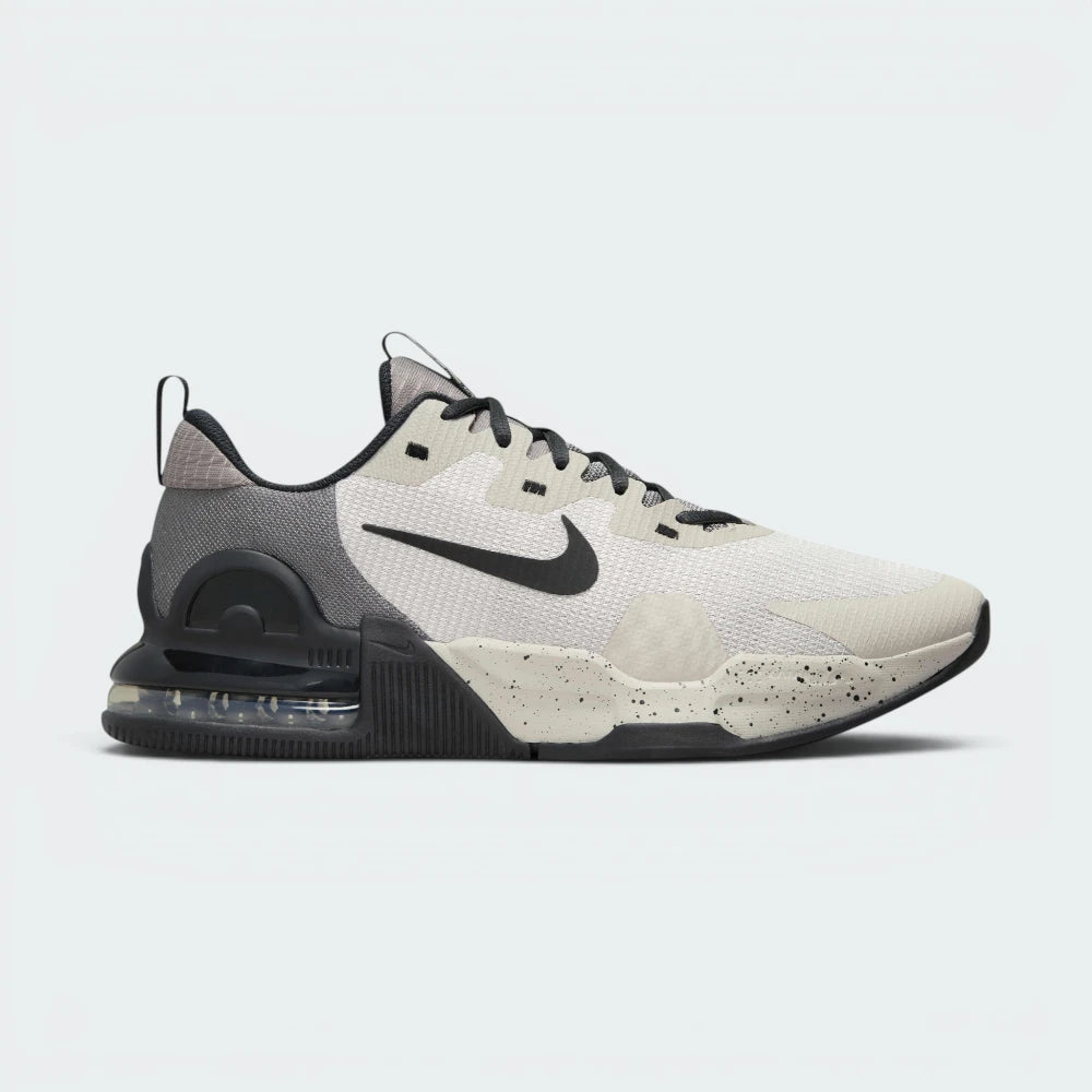 Highlights the high-velocity lines of the visible Max Air unit sitting embedded inside the professional depth of the Light Iron Ore foam midsole wall.