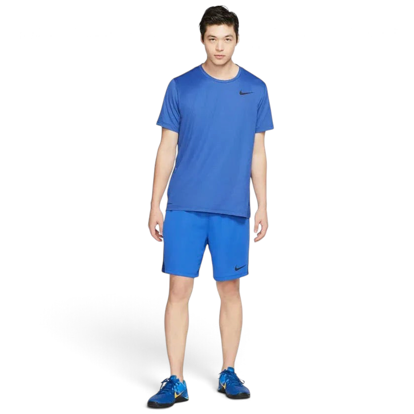 Nike Men's Dri-FIT 8" running shorts in obsidian worn by a male runner, side profile highlighting the 8-inch inseam and freedom of movement.