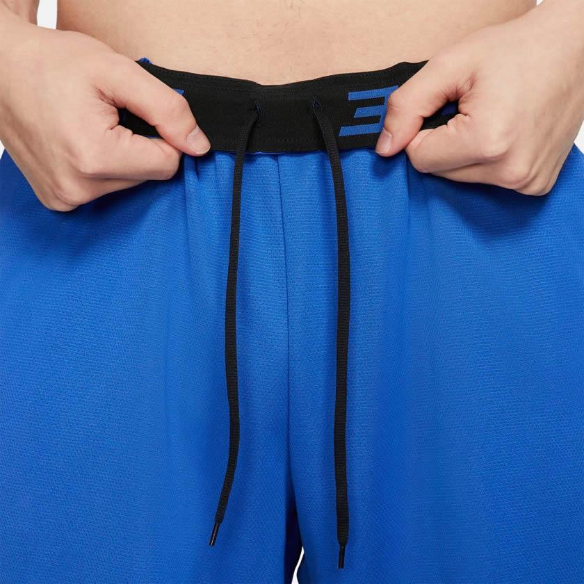Detailed zoom on the elastic waistband and internal drawcord of the Nike Men's Dri-FIT 8" running shorts, highlighting the adjustable fit.