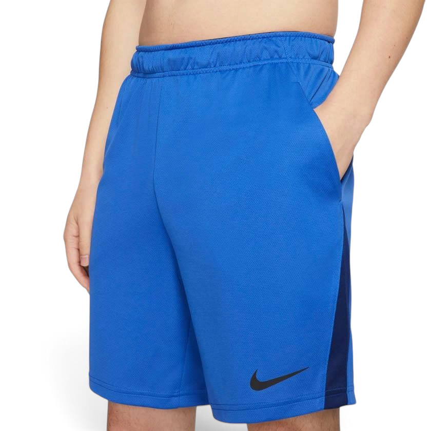 Close-up zoom on the fabric of the Nike Men's Dri-FIT 8" running shorts in obsidian, showing the lightweight, moisture-wicking texture and the embroidered white Nike Swoosh.
