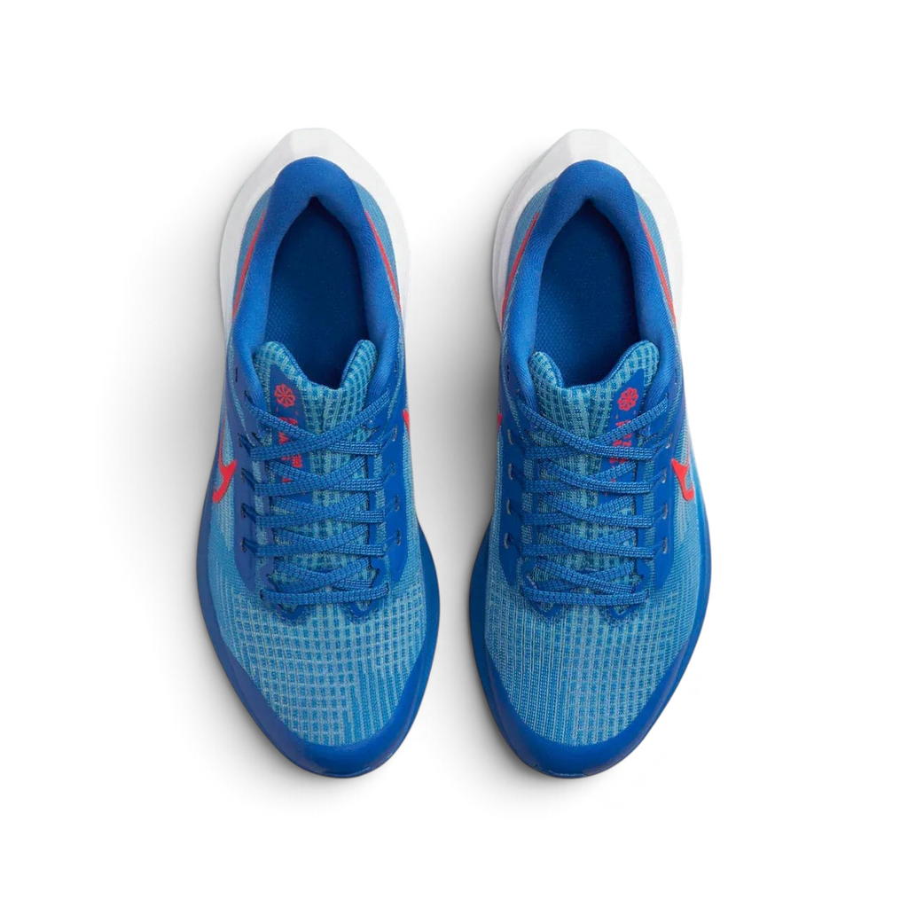 Top-down view of the junior trainers, highlighting the breathable mesh upper and the Bright Crimson lacing accents.