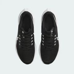 Top-down view of a pair of Nike Air Zoom Pegasus 39 Next Nature running trainers in black and white, highlighting their streamlined silhouette and lace-up closure.