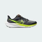 Nike Air Max Alpha Trainer 5 Men's shoes in black with white accents, side profile showing visible Max Air unit in the heel, durable mesh upper, and supportive overlays.