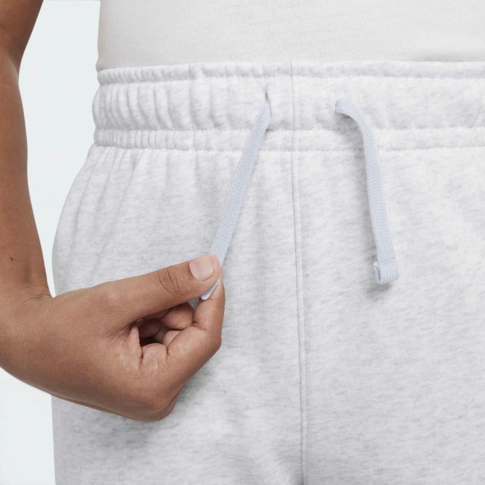 Highlights the "unreal" clean finish where the ribbed elastic waistband securely bonds to the main fleece body framework, engineered for long-term shape retention.