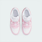 Top-down view of the infant trainers, showcasing the perforated toe box and the secure pink hook-and-loop strap.
