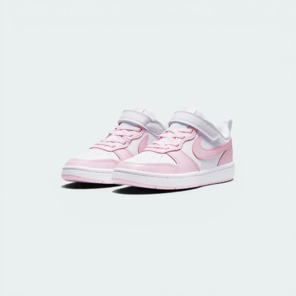 Three-quarter view of the pair, showing the clean white leather construction and the "Pink Foam" heel accents.