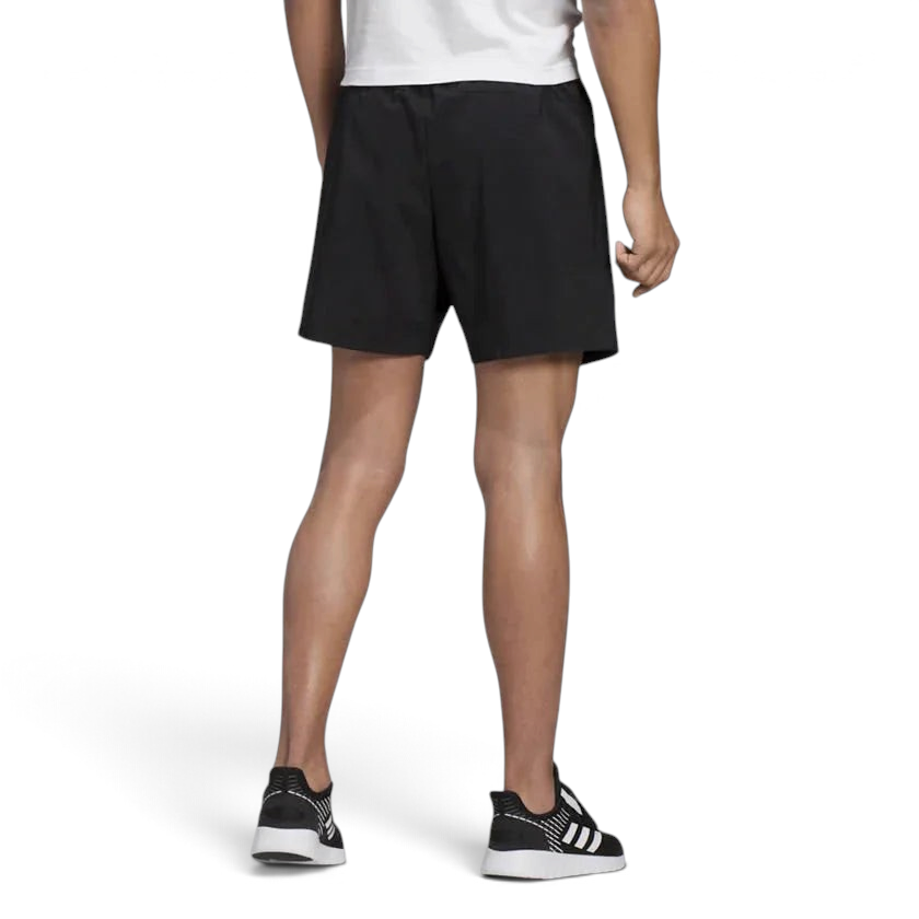 adidas Essentials Men's Chelsea Shorts DQ3085 worn in a standing pose showing athletic fit