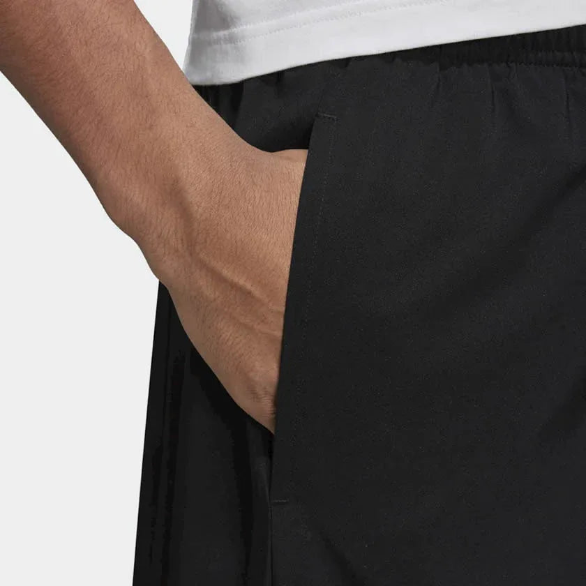 Close-up of adidas Essentials Men's Chelsea Shorts DQ3085 lightweight polyester fabric with mesh lining