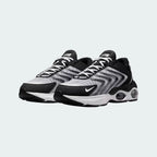 Rear view of the Nike Air Max TW trainers in black, focusing on the prominent, accentuated heel counter and the visible Air cushioning windows.