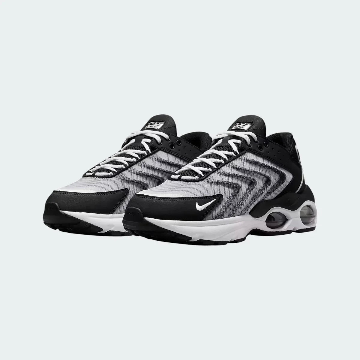 Rear view of the Nike Air Max TW trainers in black, focusing on the prominent, accentuated heel counter and the visible Air cushioning windows.