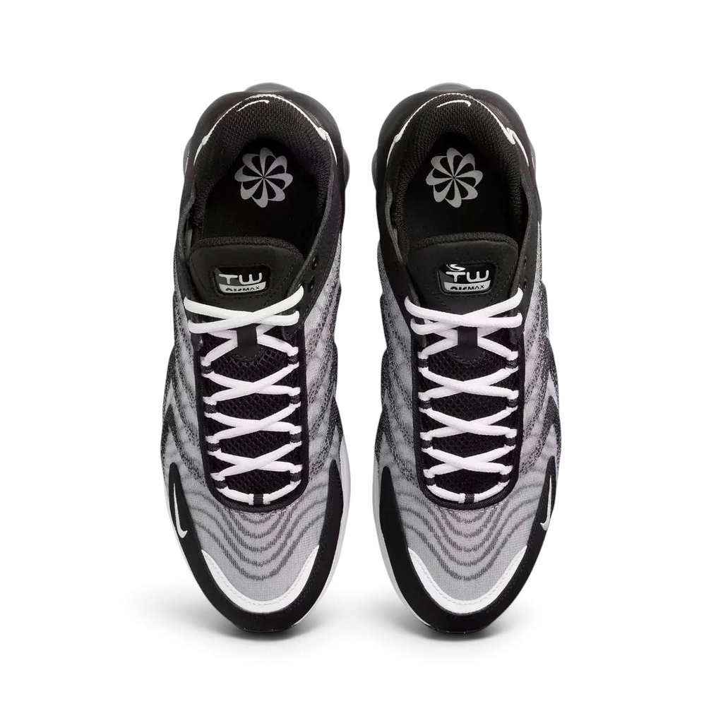 Top-down view of a pair of Nike Air Max TW trainers in black, highlighting the dynamic lace-up system and multi-layered mesh upper texture.