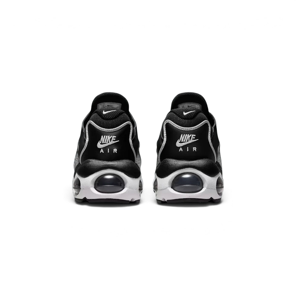 Rear view of the Nike Air Max TW trainers in black, focusing on the prominent, accentuated heel counter and the visible Air cushioning windows.