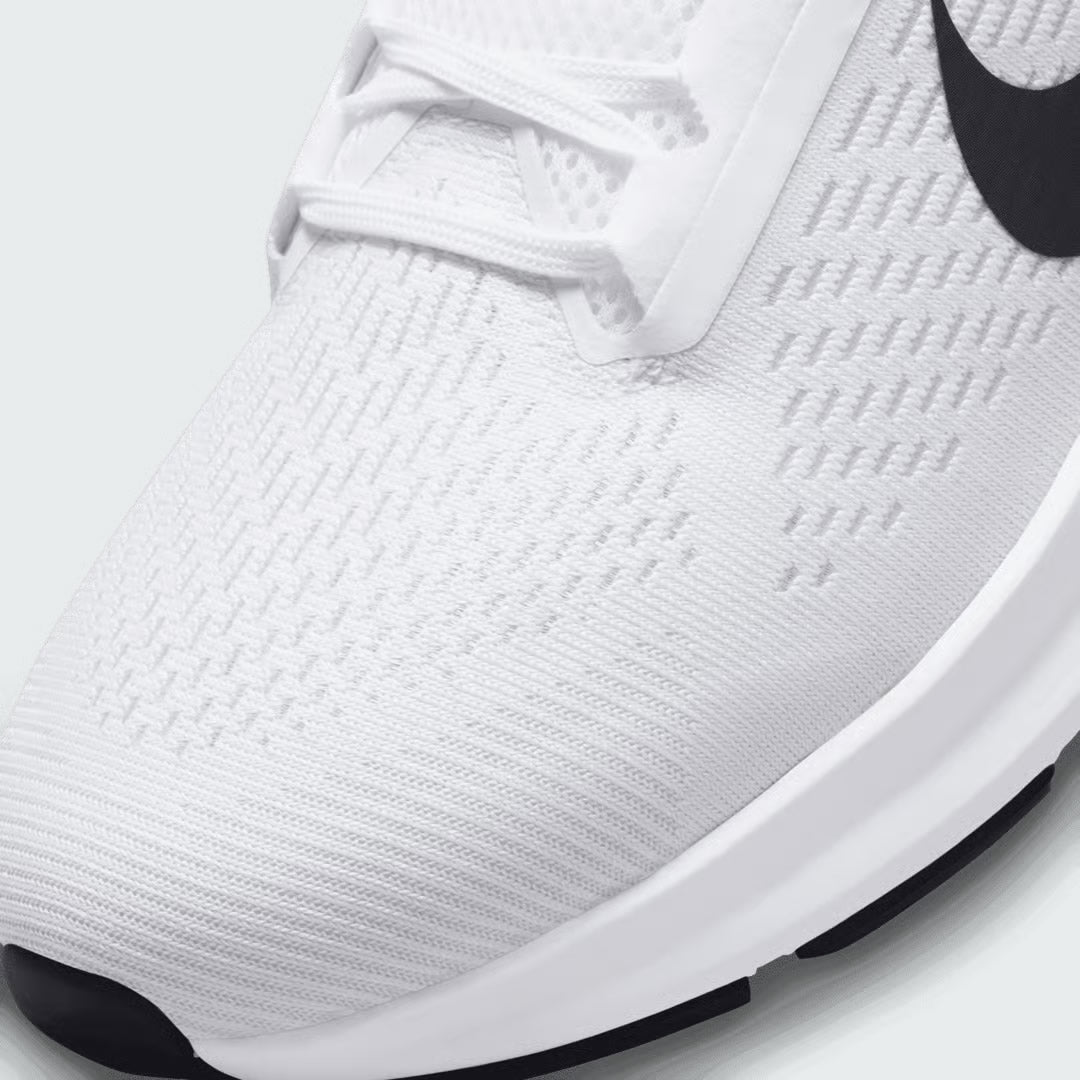 Close-up zoom on the front of the Nike Air Zoom Structure 24 Men's white running trainers, showing the breathable engineered mesh texture, lacing system, and forefoot detail.