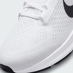 Close-up zoom on the front of the Nike Air Zoom Structure 24 Men's white running trainers, showing the breathable engineered mesh texture, lacing system, and forefoot detail.