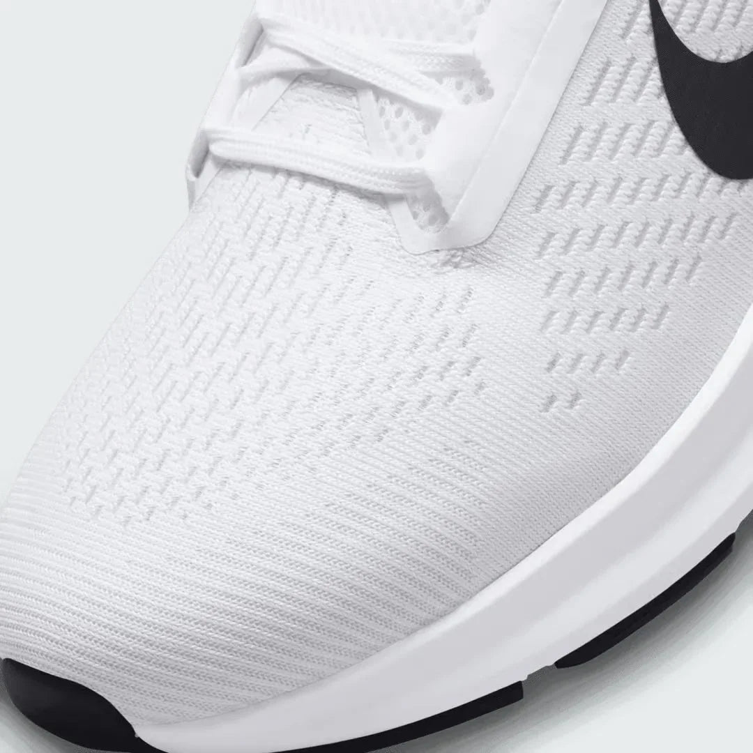 Close-up zoom on the front of the Nike Air Zoom Structure 24 Men's white running trainers, showing the breathable engineered mesh texture, lacing system, and forefoot detail.