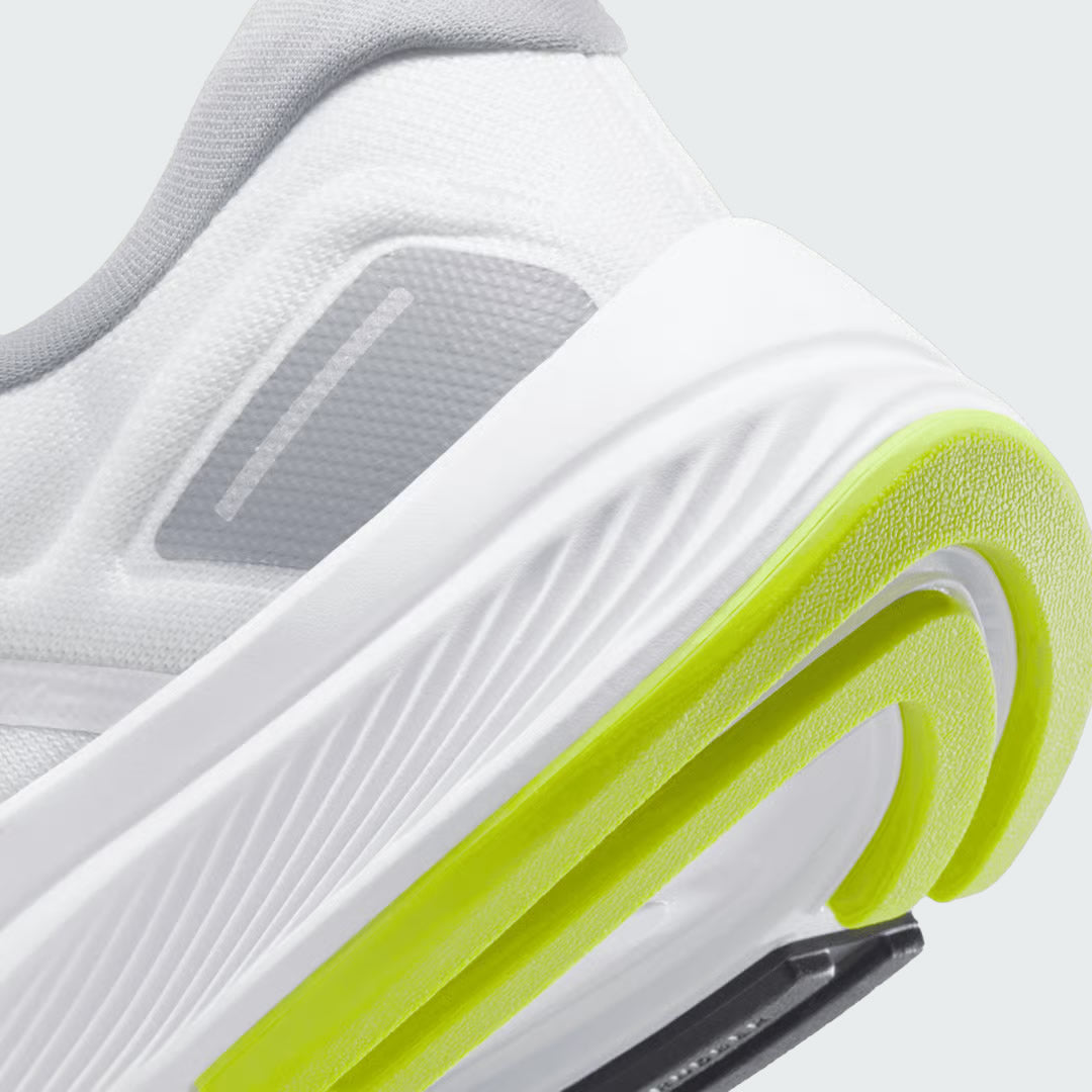 Detailed zoom on the outsole and midsole of the Nike Air Zoom Structure 24 Men's white running trainers, highlighting the cushioned foam, visible Zoom Air unit, and durable rubber outsole with stability elements.