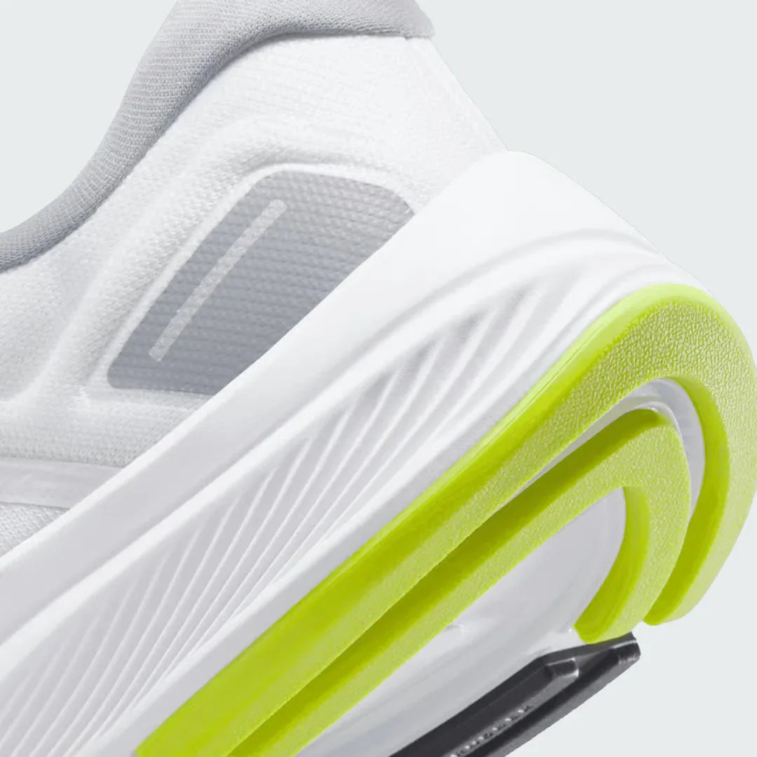 Detailed zoom on the outsole and midsole of the Nike Air Zoom Structure 24 Men's white running trainers, highlighting the cushioned foam, visible Zoom Air unit, and durable rubber outsole with stability elements.