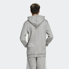 Adidas Trefoil Hoodie Men's in medium grey heather, back view showcasing the plain design and the hood worn by model