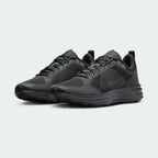 Angled view of two Nike Lunar Roam Men's trainers in dark smoke grey and black, side by side, showcasing their sleek design and chunky sole.