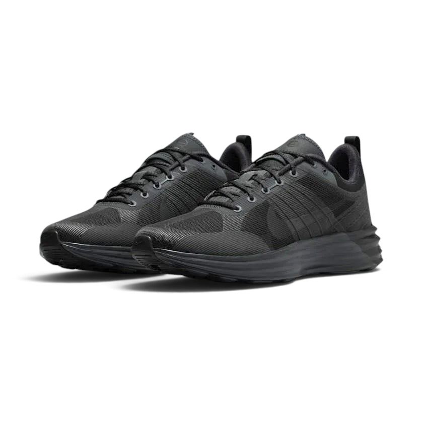 Angled view of two Nike Lunar Roam Men's trainers in dark smoke grey and black, side by side, showcasing their sleek design and chunky sole.