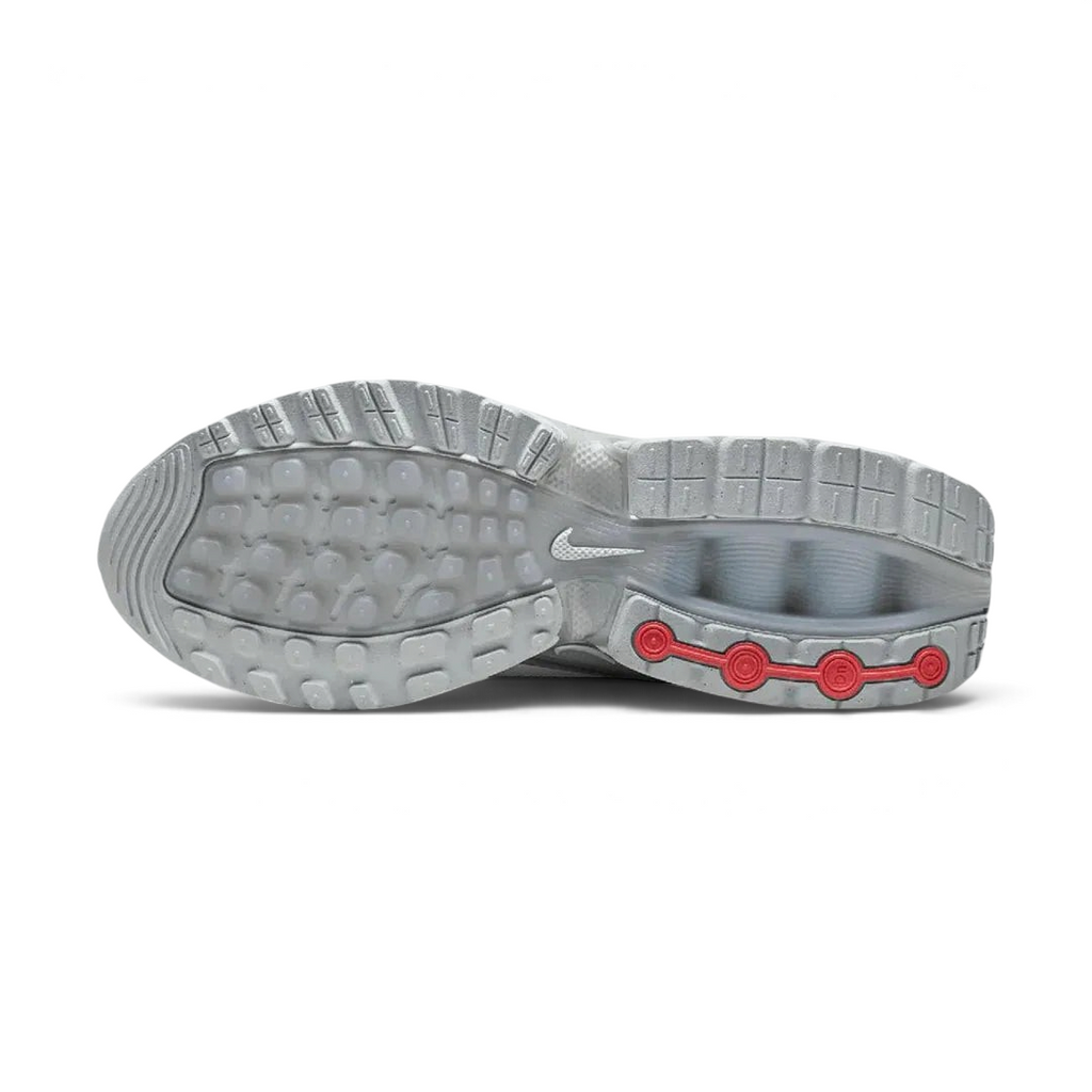 View of the outsole of the Nike Air Max DN Men's grey running shoes, showing the durable rubber tread pattern and the unique design of the visible Dynamic Air pods.