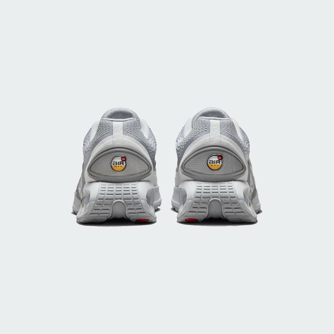 Rear view of the Nike Air Max DN Men's grey running shoes, focusing on the visible Dynamic Air unit in the heel and molded heel counter.