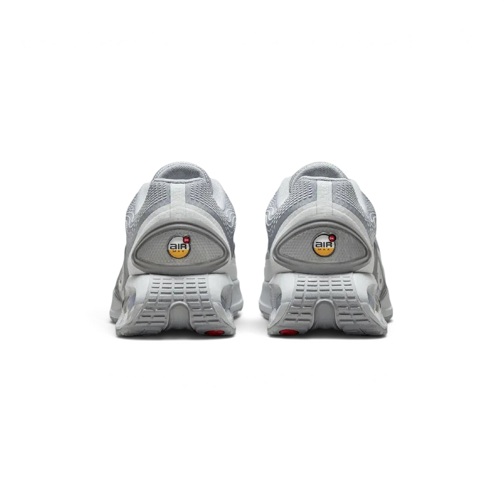 Rear view of the Nike Air Max DN Men's grey running shoes, focusing on the visible Dynamic Air unit in the heel and molded heel counter.