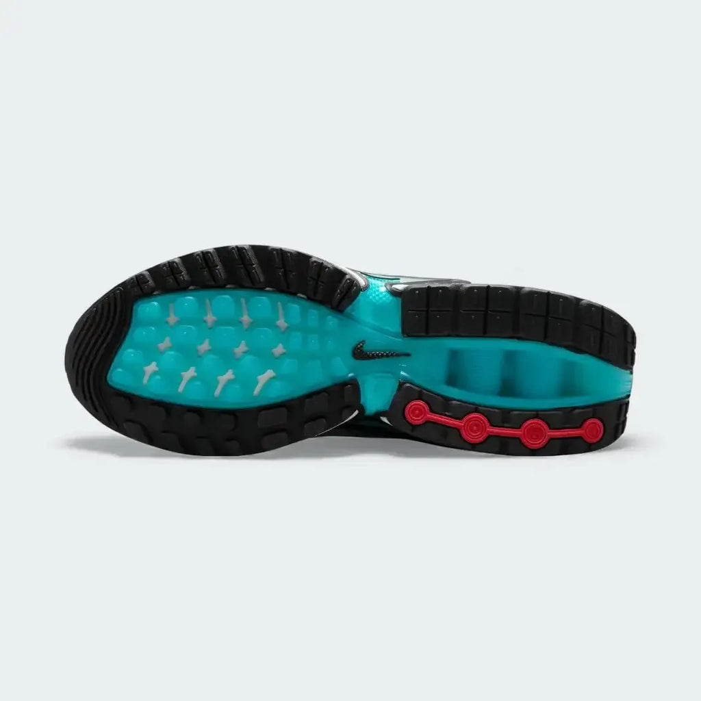 View of the outsole of the Nike Air Max DN Men's grey running shoes, showing the durable rubber tread pattern and the unique design of the visible Dynamic Air pods.