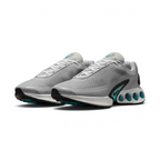 Angled view of two Nike Air Max DN Men's grey running shoes, side by side, showcasing their bold, modern design and prominent Air unit.