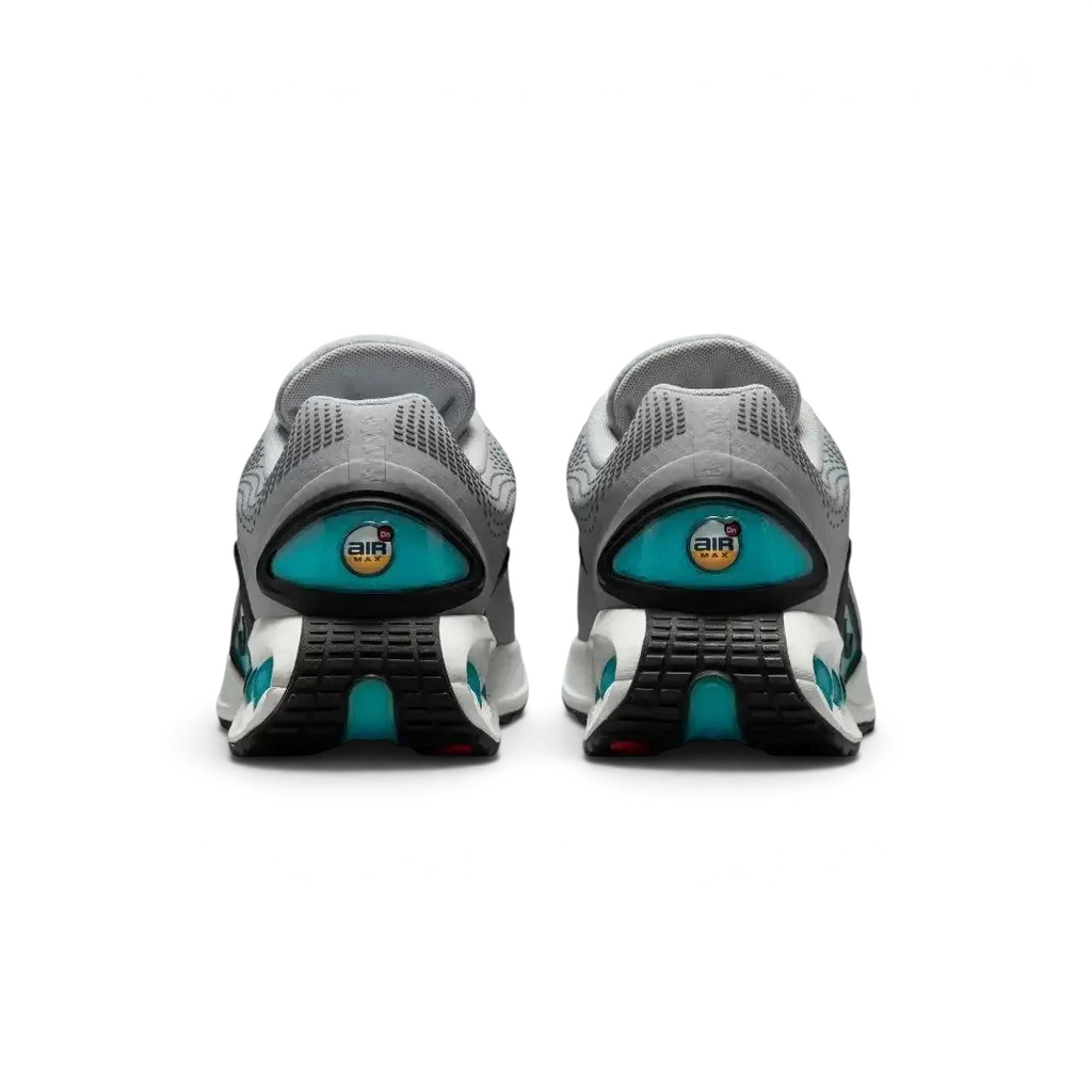 Rear view of the Nike Air Max DN Men's grey running shoes, focusing on the visible Dynamic Air unit in the heel and molded heel counter.