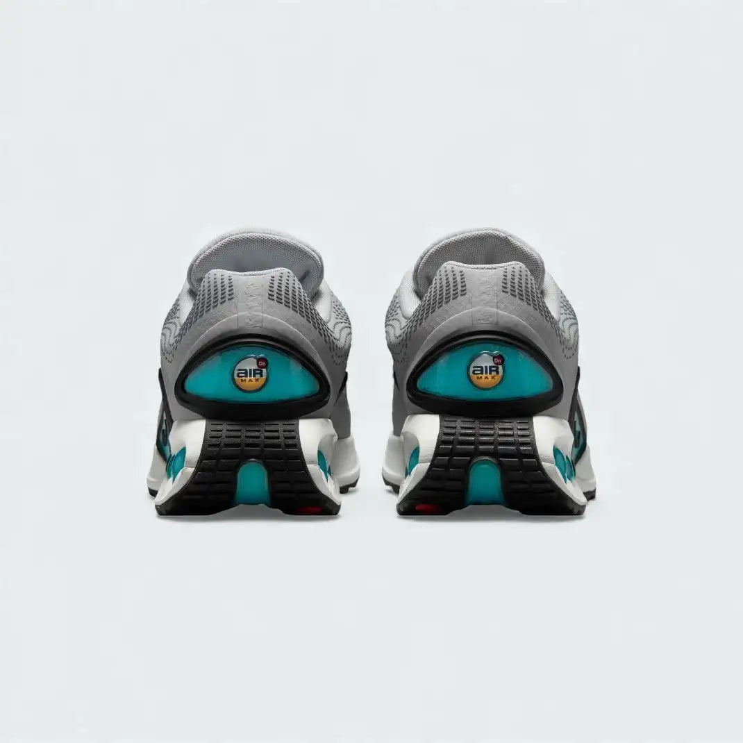 Rear view of the Nike Air Max DN Men's grey running shoes, focusing on the visible Dynamic Air unit in the heel and molded heel counter.