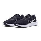 Emphasising the low-slung, athletic road-running stance and the crisp contrast between the all-black engineered mesh body and the bright white cushioning midsole.
