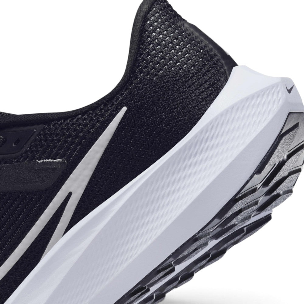 Highlights the "unreal" clean finish where the sculpted React foam midsole meets the trailing tail of the white Swoosh outline and grooved rubber Waffle outsole tread.