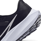 Highlights the "unreal" clean finish where the sculpted React foam midsole meets the trailing tail of the white Swoosh outline and grooved rubber Waffle outsole tread.