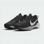 Showcases a three-quarter front angle of both shoes, emphasizing the rugged off-road stance, reinforced synthetic toe bumpers, breathable forefoot mesh perforations, and high-visibility white Swooshes.