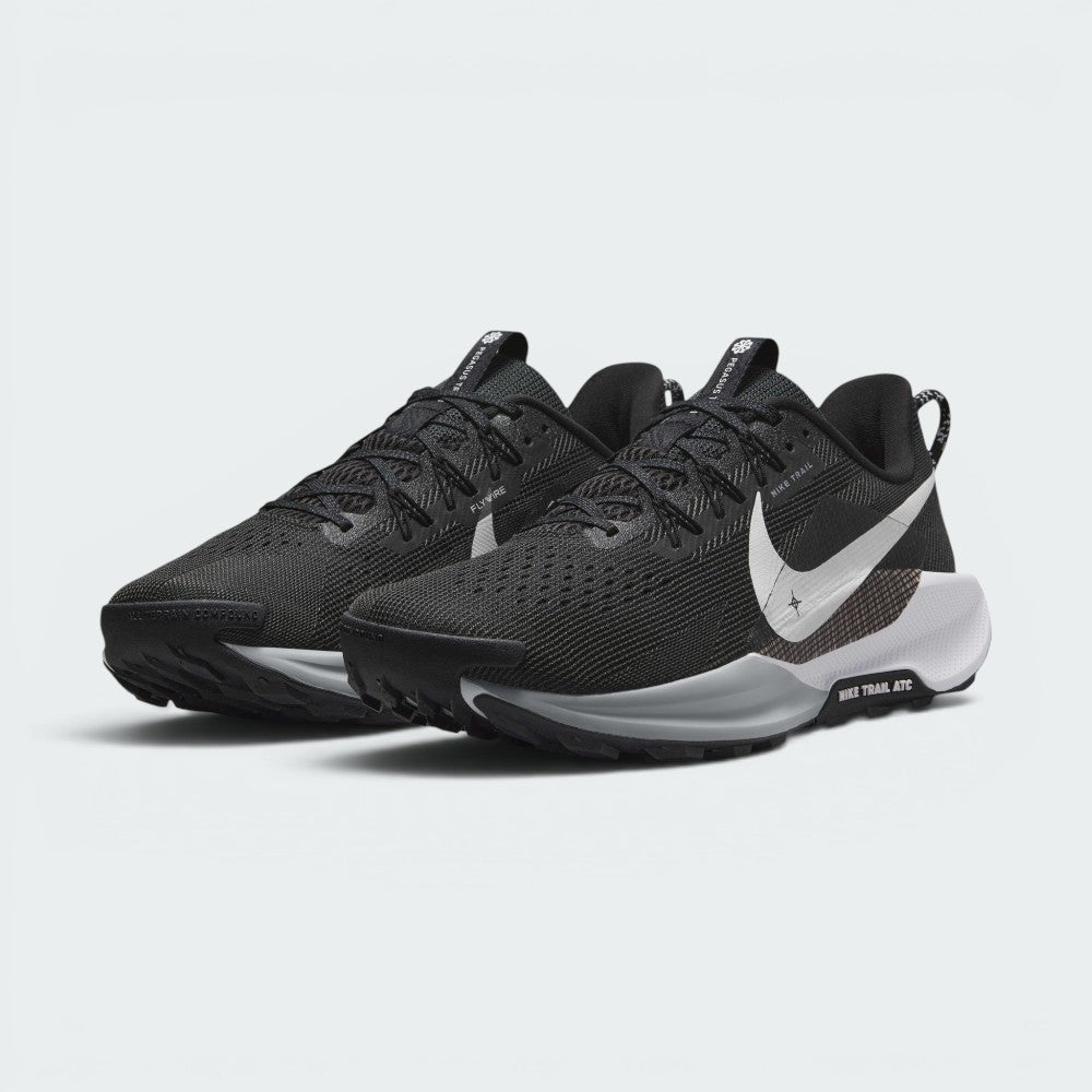 Showcases a three-quarter front angle of both shoes, emphasizing the rugged off-road stance, reinforced synthetic toe bumpers, breathable forefoot mesh perforations, and high-visibility white Swooshes.