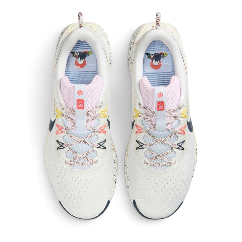 Focuses on the locked-in lacing layout, displaying the Pink Foam mesh tongues, patterned flecked laces, yellow, pink, and navy Flywire eyelet cables, and insoles printed with Mount Fuji sunrise graphics.