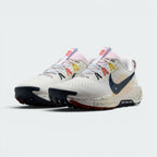 Emphasising the low-cut, aggressive off-road stance of the trainers and the professional colour harmony of the white uppers sitting cleanly above the paint-splattered ReactX foam midsoles.