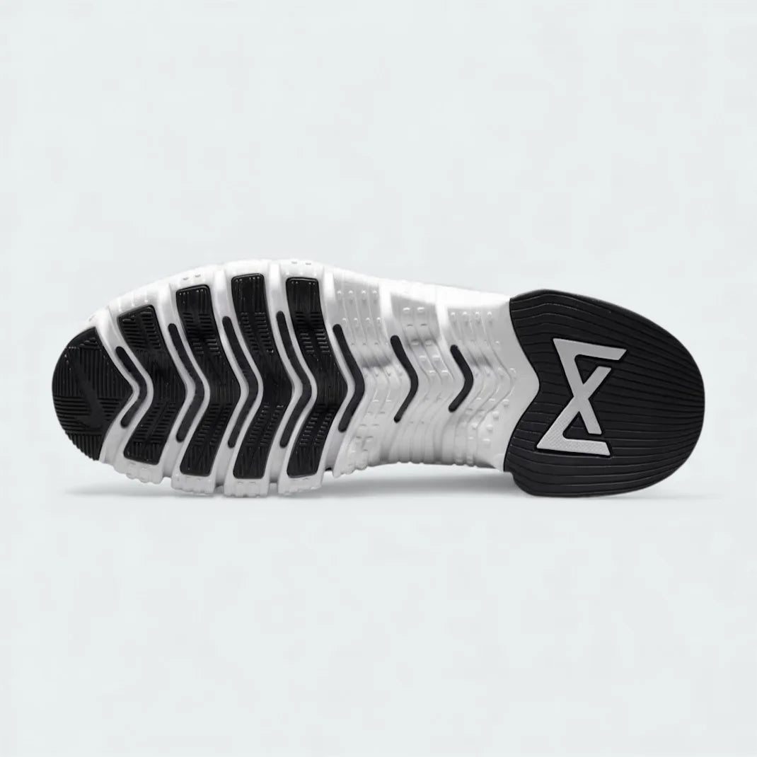 View of the outsole of the Nike Free Metcon 5 Men's black training shoes, showing the multi-directional traction pattern for versatile gym performance.