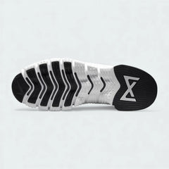 View of the outsole of the Nike Free Metcon 5 Men's black training shoes, showing the multi-directional traction pattern for versatile gym performance.