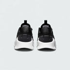 Rear view of the Nike Free Metcon 5 Men's black training shoes, focusing on the wide, flat heel for lifting stability and subtle branding.