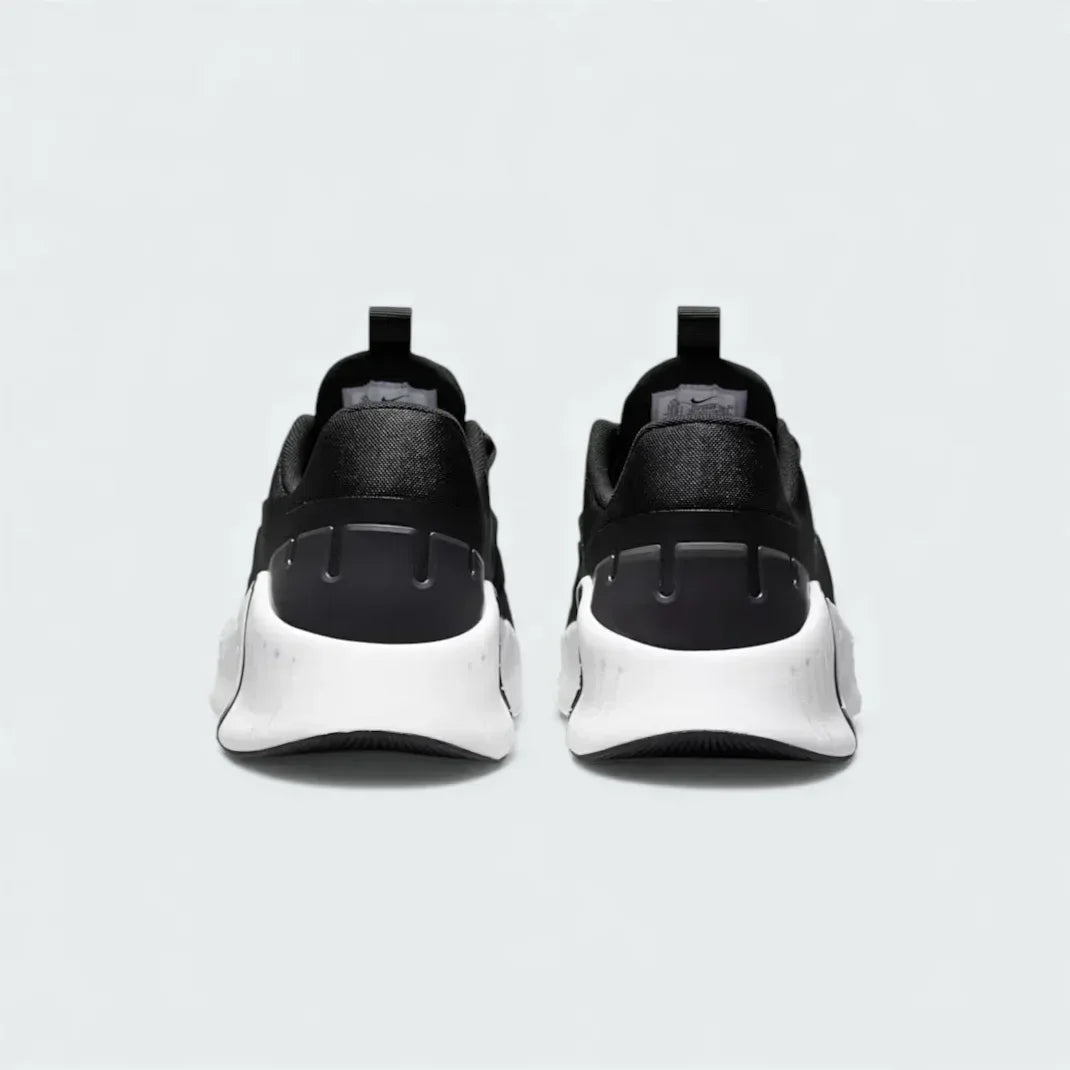 Rear view of the Nike Free Metcon 5 Men's black training shoes, focusing on the wide, flat heel for lifting stability and subtle branding.
