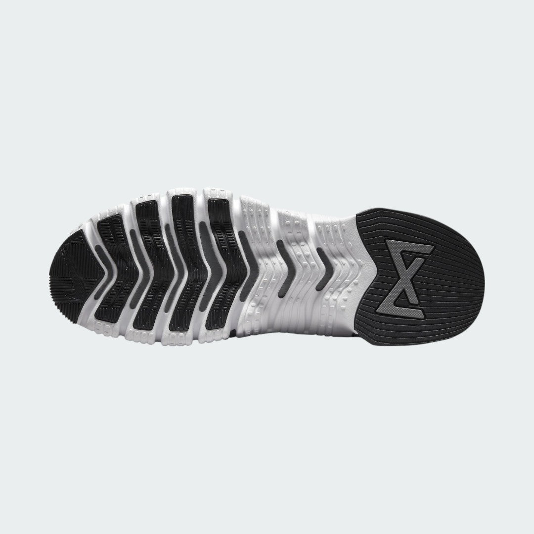 View of the outsole of the Nike Free Metcon 5 Men's grey training shoes, showing the multi-directional traction pattern for versatile gym performance.