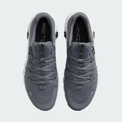 Top-down view of a pair of Nike Free Metcon 5 Men's training shoes in grey, highlighting their athletic silhouette and lace-up closure.