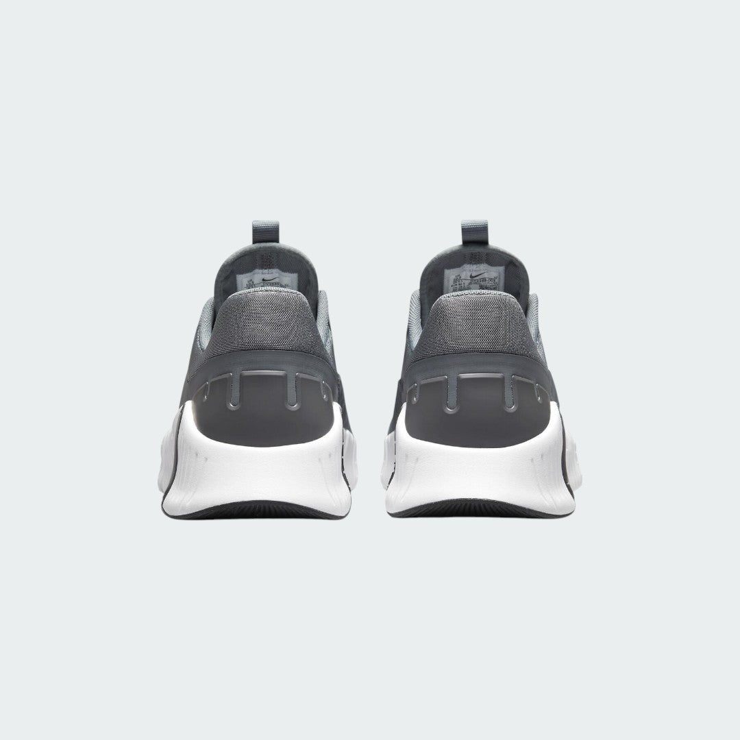Rear view of the Nike Free Metcon 5 Men's grey training shoes, focusing on the wide, flat heel for lifting stability and subtle branding.