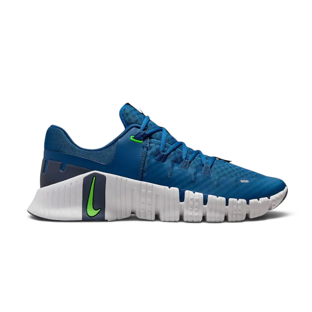Nike Free Metcon 5 Men's training shoes in blue with white accents, side profile showing mesh upper, flexible forefoot, and stable heel.