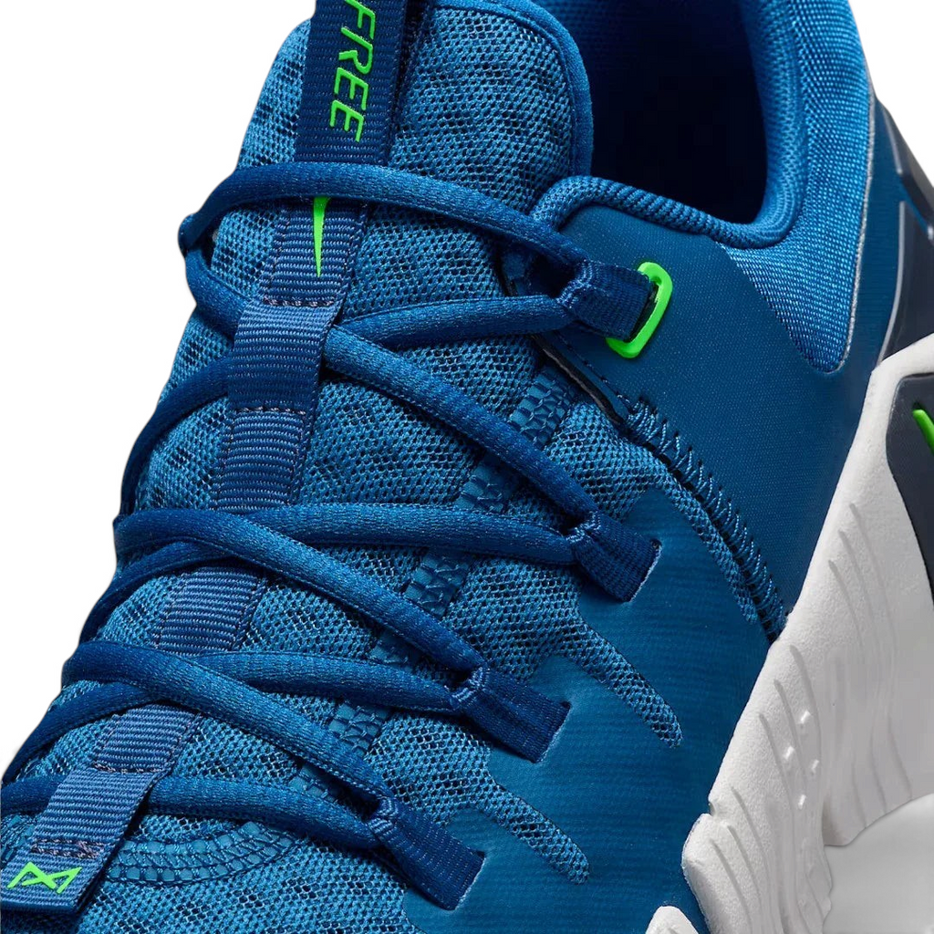 Close-up zoom on the front of the Nike Free Metcon 5 Men's blue training shoes, showing the breathable mesh upper texture, lacing system, and flexible toe area.