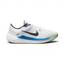 Nike Air Winflo 10 Men's trainers in white, side profile showing the bold black Swoosh, Star Blue midsole accents, and breathable mesh upper.